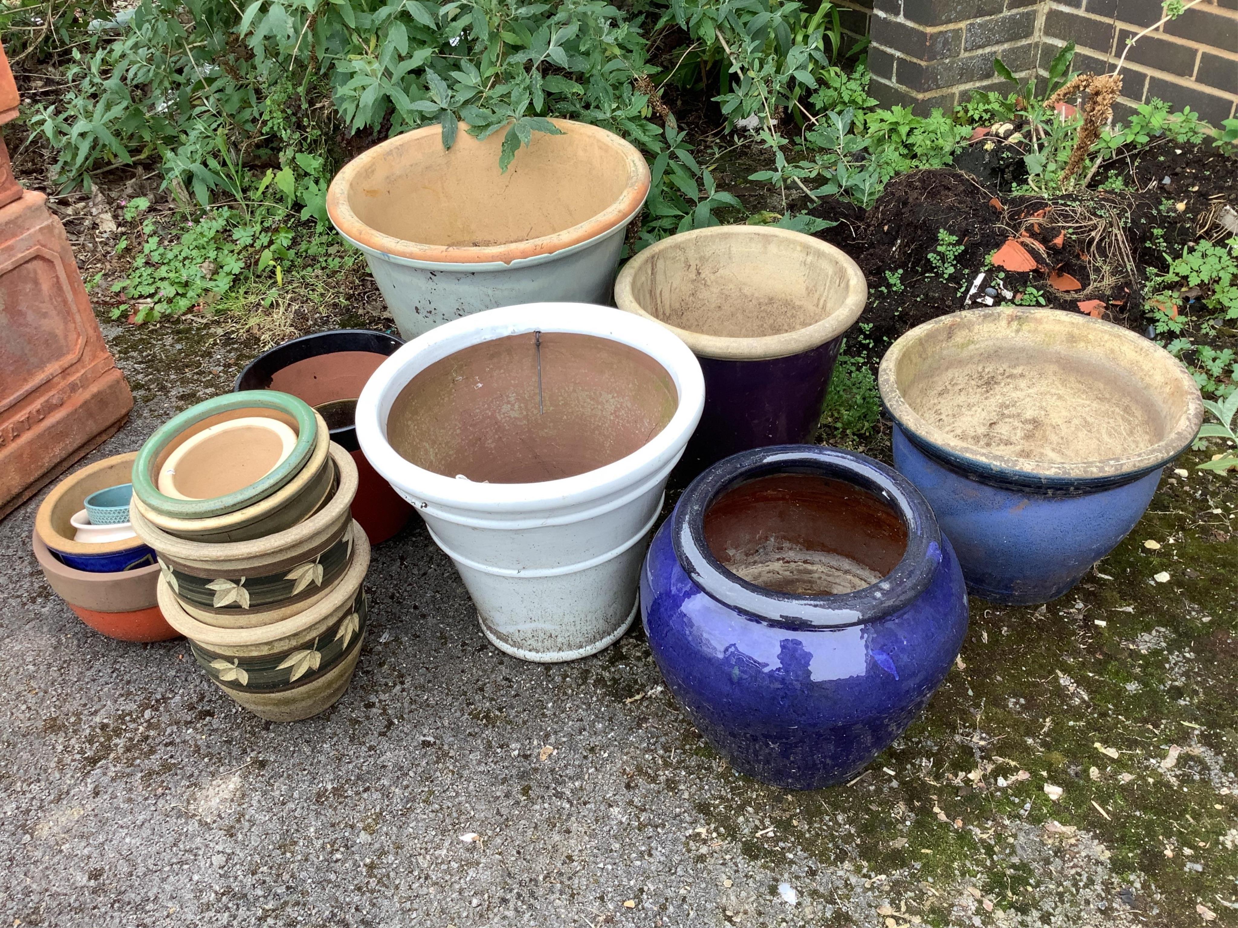 Fifteen assorted glazed earthenware garden pots and planters, largest diameter 50cm, height 44cm